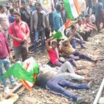 হেয়ারিং হয়রানির প্রতিবাদে জাতীয় পতাকা হাতে রেল লাইনে শুয়ে রেল অবরোধ 